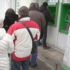 Национализация "Приватбанка": в регионах штурмуют банкоматы