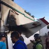 В Венесуэле самолет упал на жилой дом (фото)