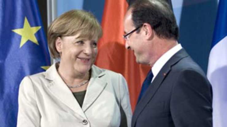 Меркель и Олланд пообещали сохранить целостность зоны евро