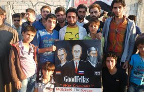 Сирийцы обвиняют Путина  и РПЦ в убийстве невинных людей. Фотограф: Мансур Омари