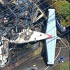 В Токио самолет рухнул на жилые дома, есть жертвы (фото)