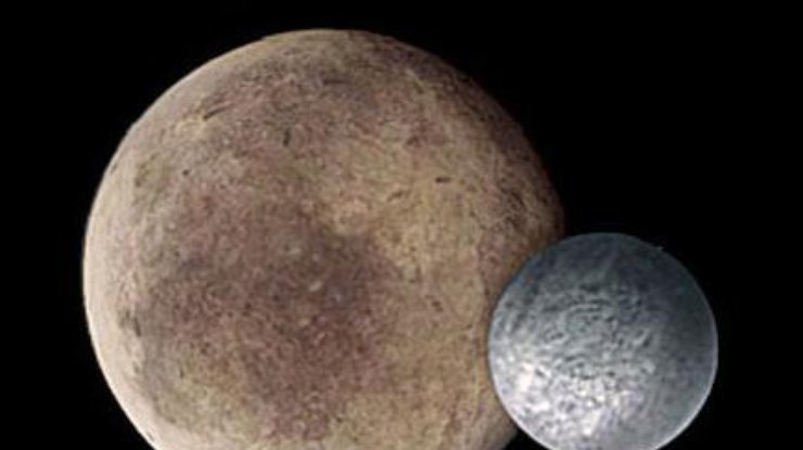 Плутон и спутник его Харон. Фото astronews.ru