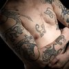 В Канаде профессор ради науки набил на тело татуировки (фото)