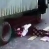 Девушка чудом выжила под колесами грузовика (видео)