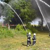 Под Киевом бушует пожар на складе древесины