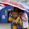 Непогода в Китае: проливные дожди уносят жизни людей 