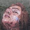 Тонущая девушка: художник создал граффити, показывающее высоту приливов (фото)