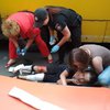 Переломаны ноги: в Мариуполе ребенка толкнули под маршрутку (фото)