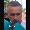 Работник прокуратуры разбил телефон участника мирной акции под САП (видео)