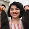 Девушка с самыми длинными волосами в мире сделала короткую стрижку (фото, видео)