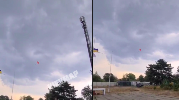 Фото: в Киеве парашютиста унесло ветром / скриншот