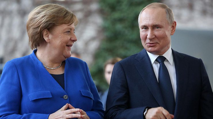 Фото: Ангела Меркель и Владимир Путин / РБК