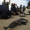 НАТО ждет от Каддафи прекращения огня