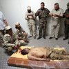 В Каддафи стреляли два раза: В живот и голову