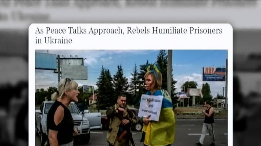 Террористы избили и унизили женщину, завернутую во флаг Украины (видео)